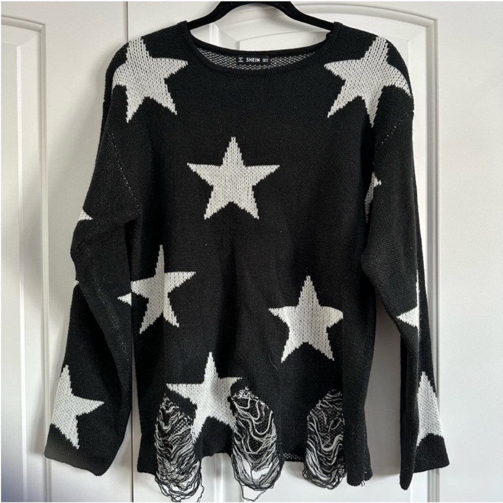 Distressed star sweater